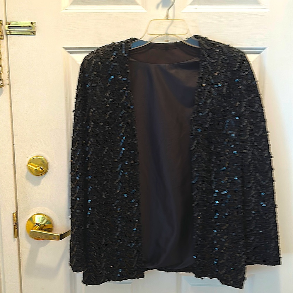 Beautiful sequenced, formal jacket with shoulder pads. Only worn once.